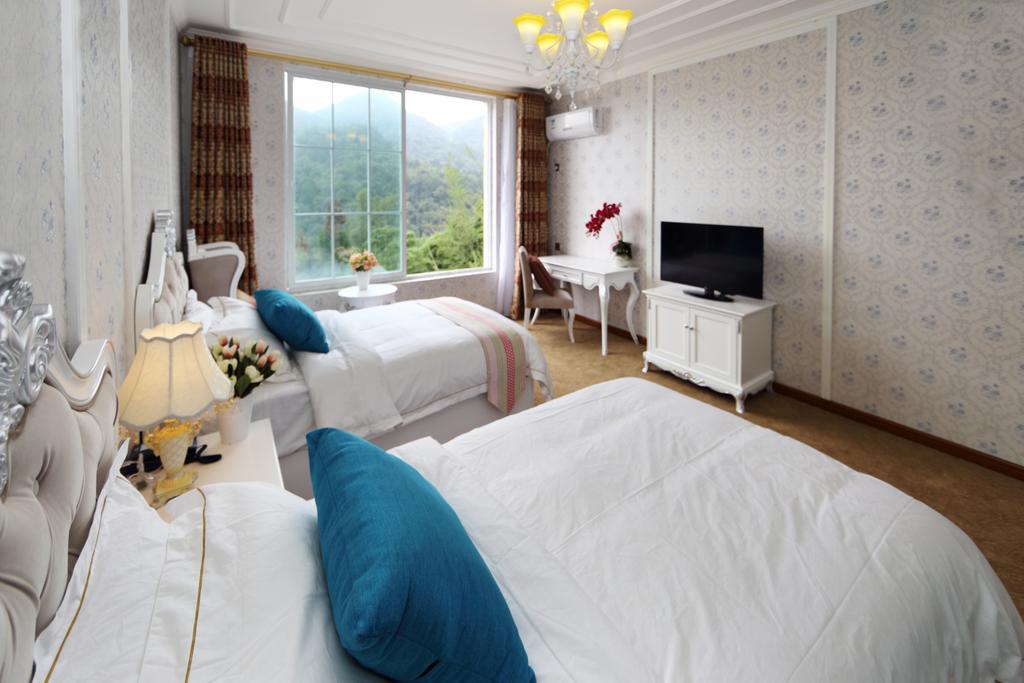 Panshan Tingquan Tuwo Holiday Resort Le-šan Pokoj fotografie